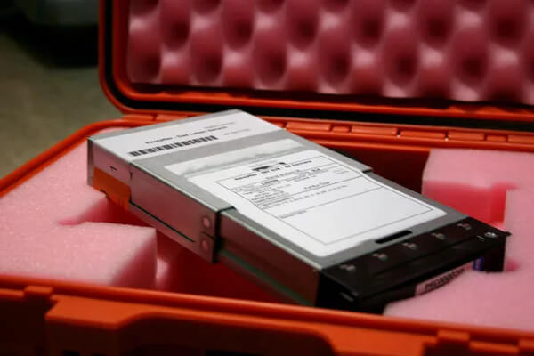 A digital cinema package used for video file transfer sits in a pelican case with red foam padding